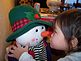 Alayna Kremer loving up Mr. Snowman. Taken 12-12-09 Cascade, IA by Patti Menster.