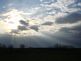 Sun Rays shining down through the clouds. Taken 4-15-10 Backyard by Peggy Driscoll.